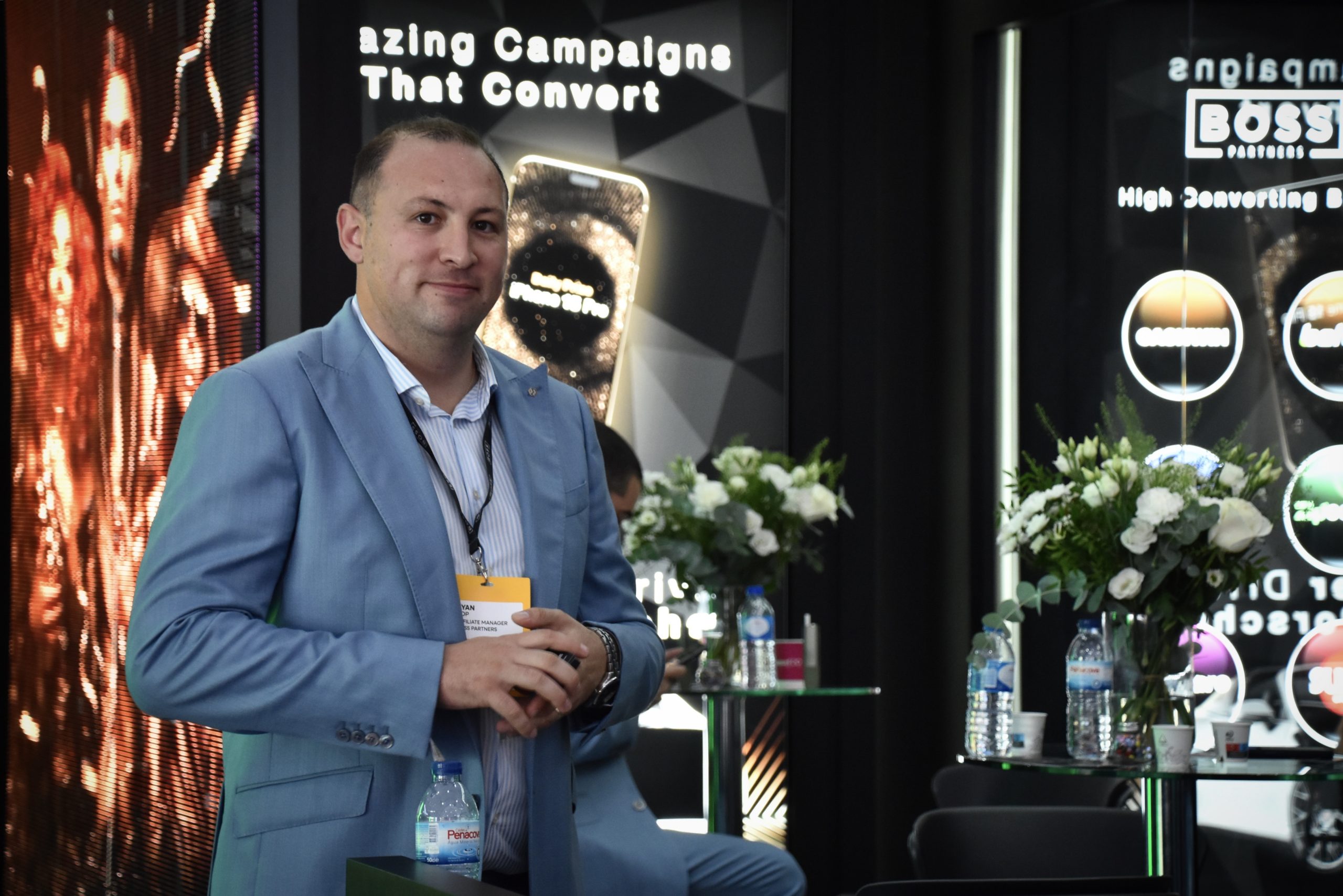 Ryan Pop, Affiliate Manager at Boss Partners, standing at the Boss booth during iGB Affiliate Barcelona 2025